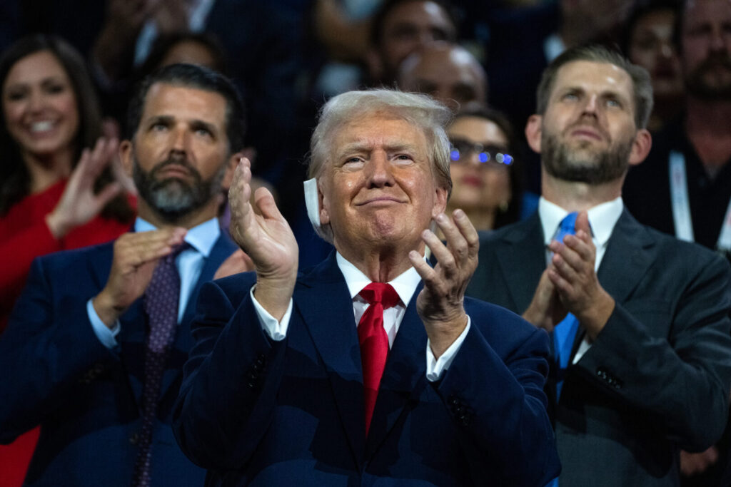 Former President Donald Trump, the Republican presidential nominee, is pictured with his sons Don Jr., left, and Eric, in Fiserv Forum on the first day of Republican National Convention in Milwaukee on Monday.